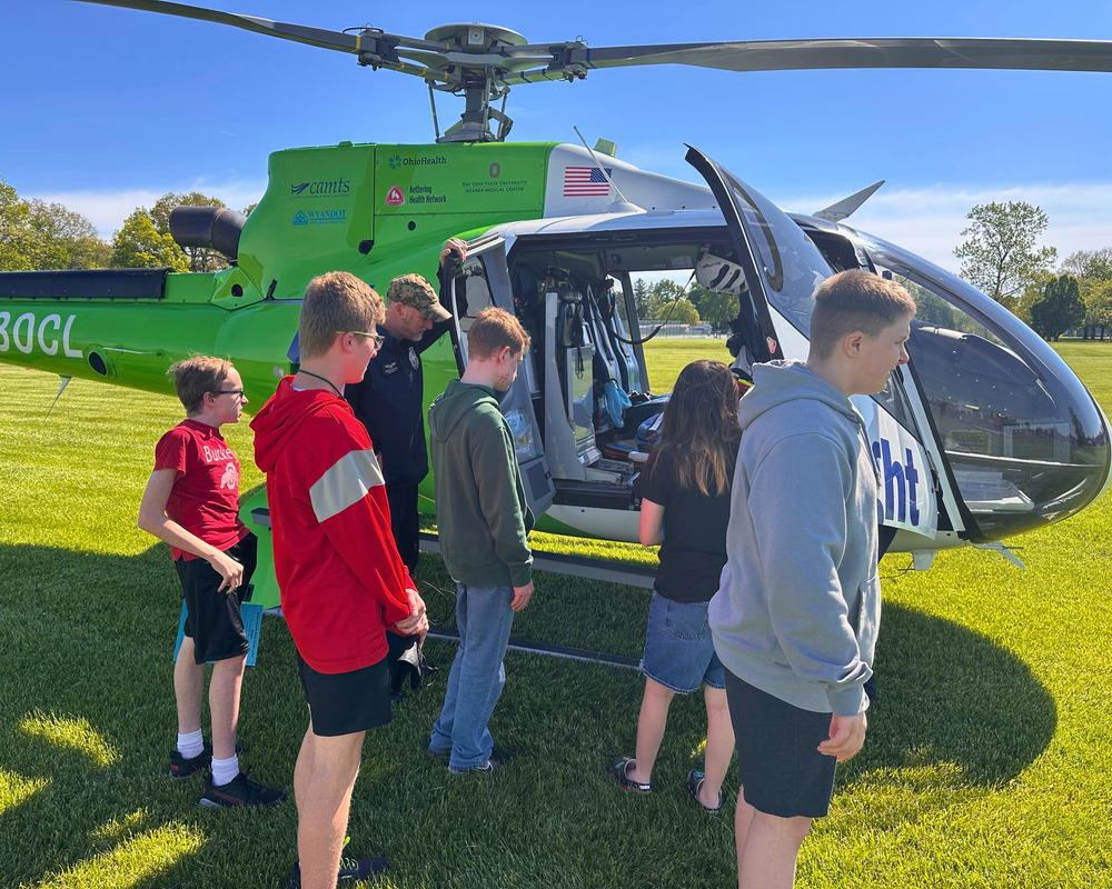 BMS students listen on as Med Flight shares career information.