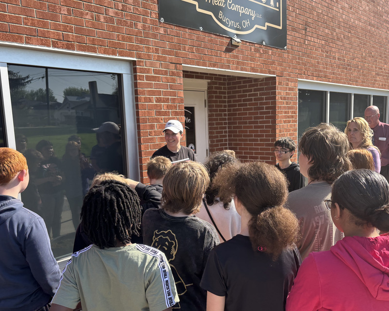 Jessica Alt and students stand outside of Center Street Meat Company.