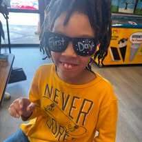 photo of a student rocking his first day of school sunglasses