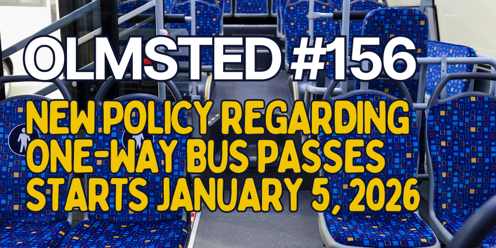 Interior of a bus with blue patterned seats. Text reads: “Olmsted #156 – New one-way bus pass policy starts January 5, 2026.”