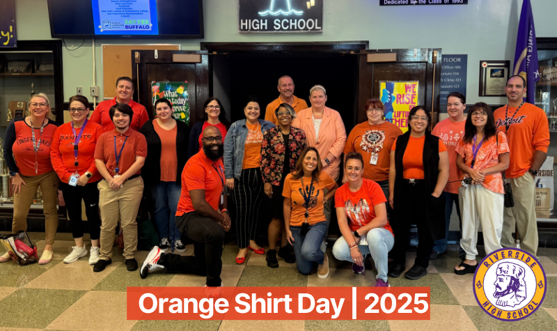 207 Staff wearing orange shirts in group photo