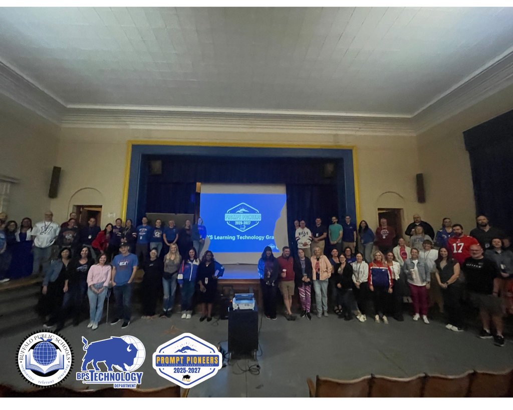 Large group photo of BPS Teachers and ITCs on a stage