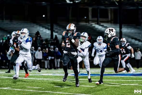 Mckinley Football player running