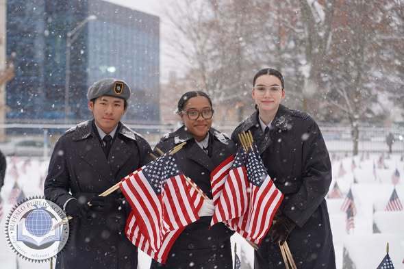 JROTC Students Paying Respects with American Flags at Soligers Cemetary