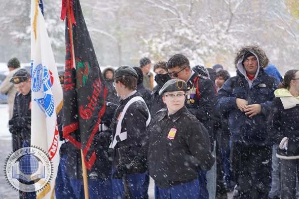 JROTC Students Paying Respects with American Flags at Soligers Cemetary