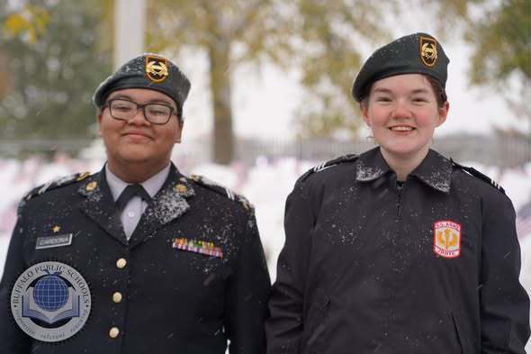 JROTC Students Paying Respects with American Flags at Soligers Cemetary