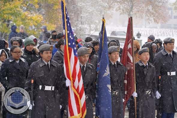 JROTC Students Paying Respects with American Flags at Soligers Cemetary
