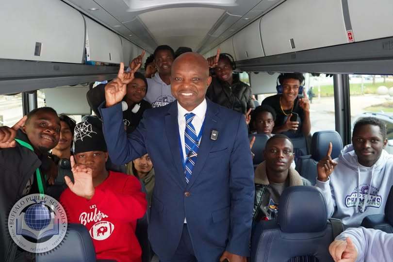 Superintendent Mubenga with Lafayette Boys Soccer team leaving on Bus