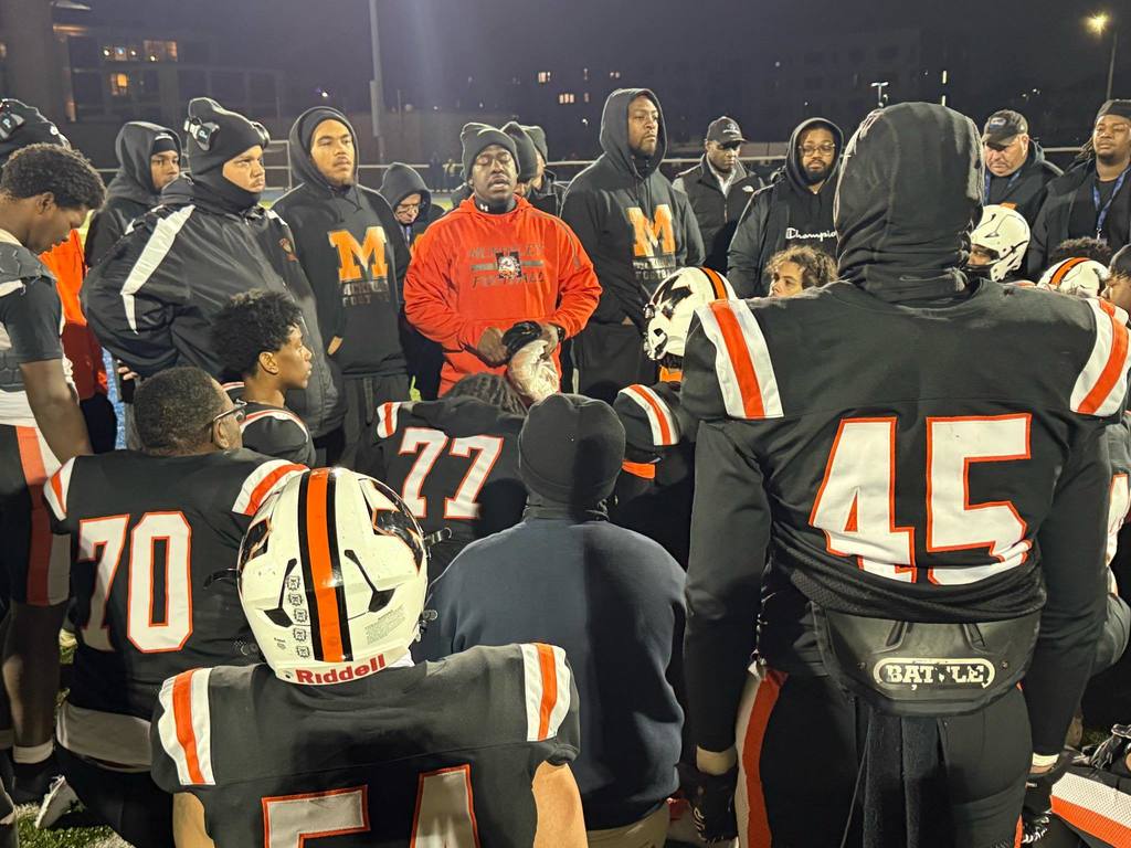 Coach talking to McKinley Football Team