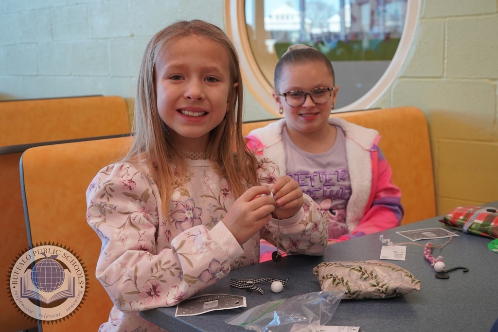 Two Students wrapping gifts