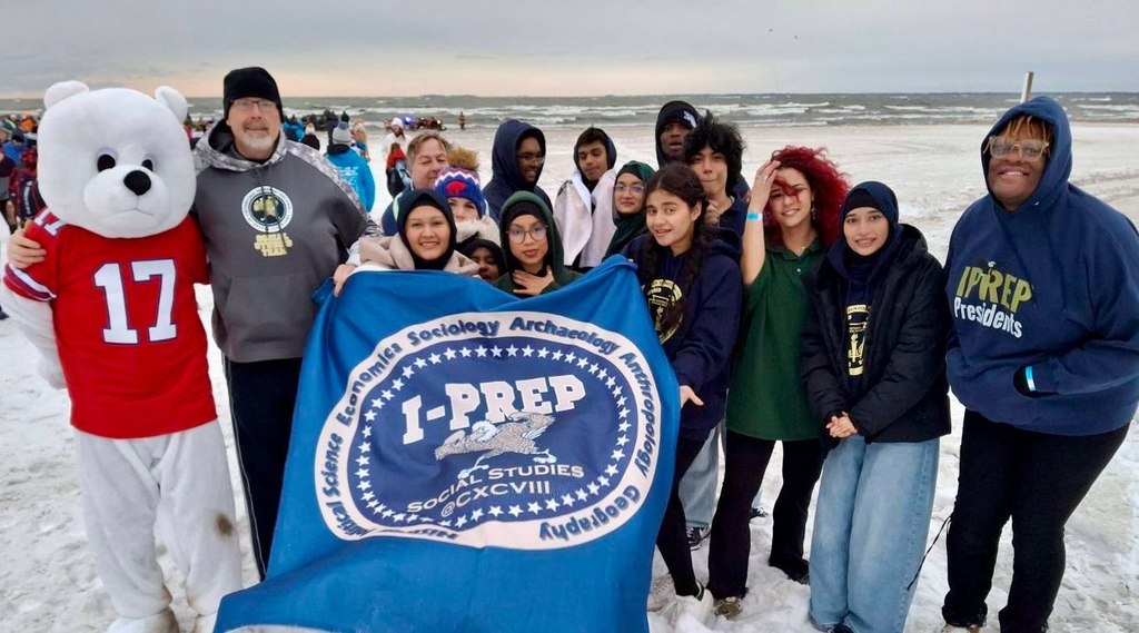 Group of iPrep Students with a polar bear mascot outside Lake Erie