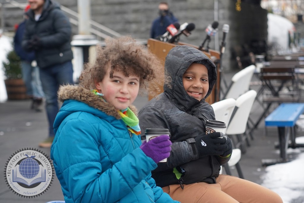 Two Girls sitting with Hot Cocoa