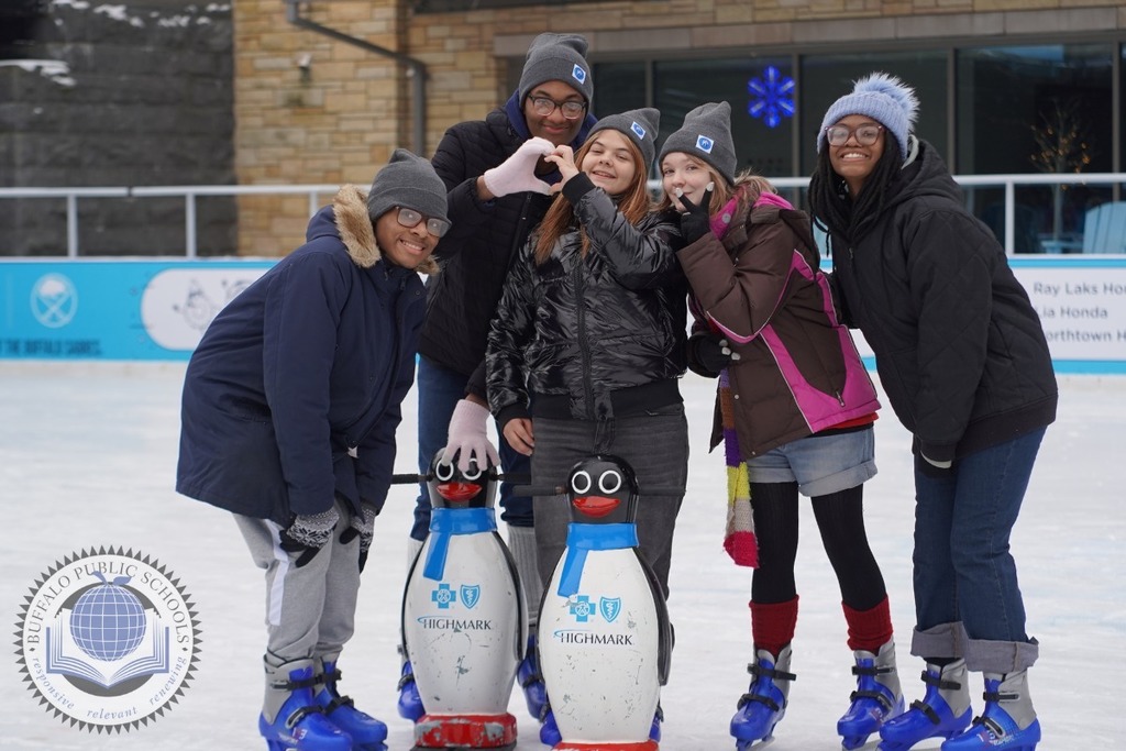 Students Ice Skating with Teacher