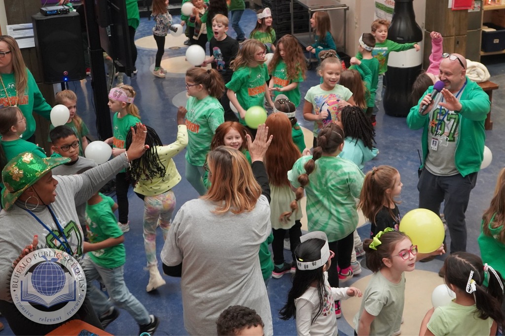 Students dancing with principal on the Microphone