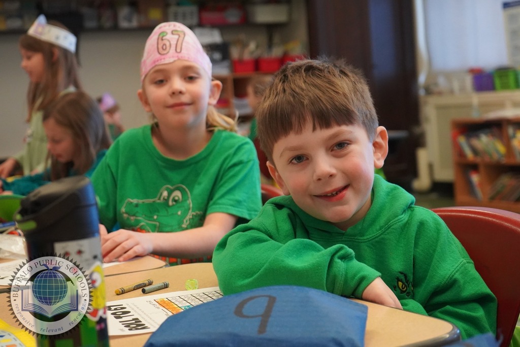 Two students sitting at desks