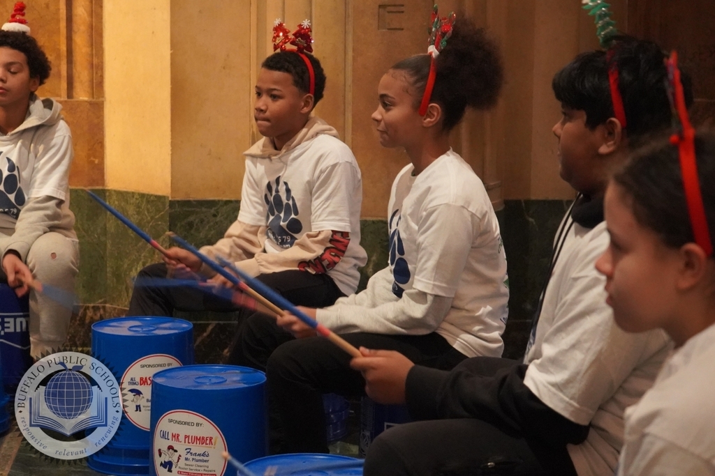 Students Playing Drums on Buckets