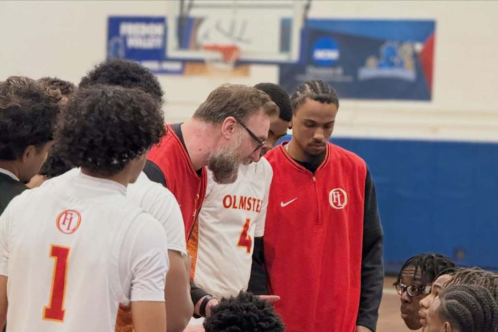 Basketball Players being coahed