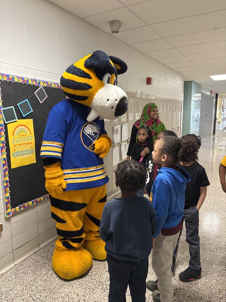 Students in hallway crowding around Sabretooth Sabres Mascot