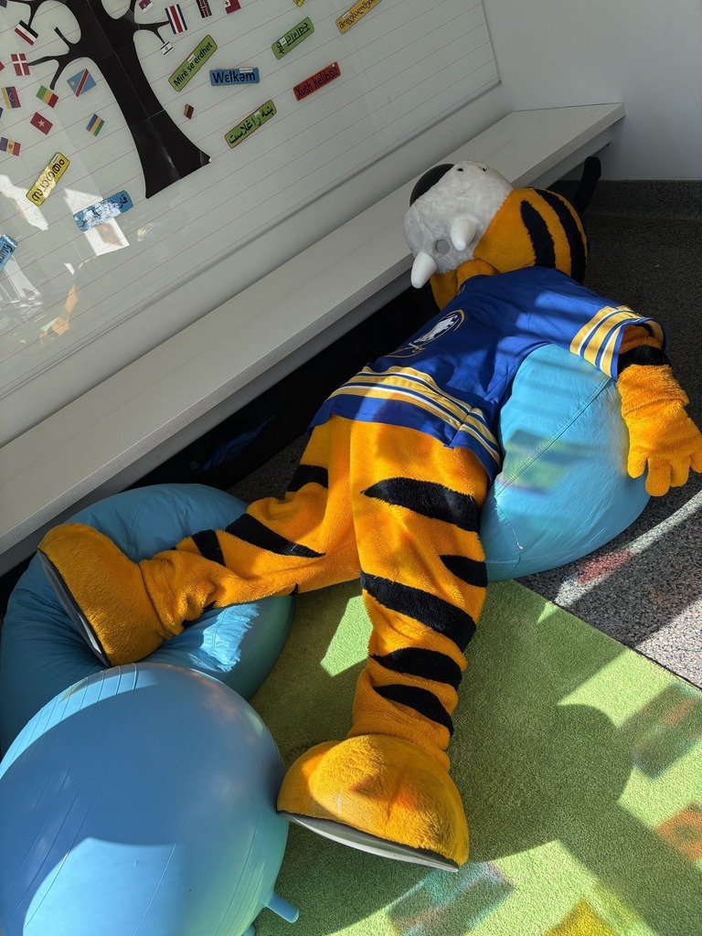 Sabretooth Sabres Mascot laying on beanbags
