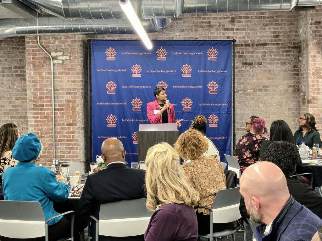 Dr. Reynolds Speaking at Podium