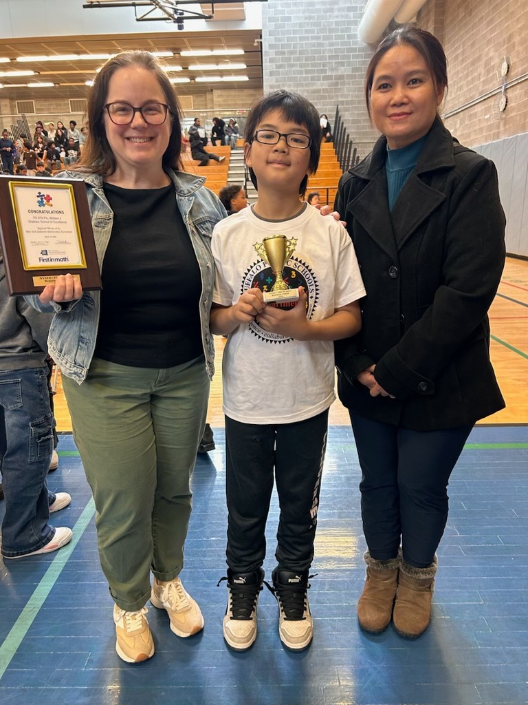 Students Holding Awards with Parents and Teachers