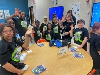 Prompt Pioneers Day Room with Peple Interacting