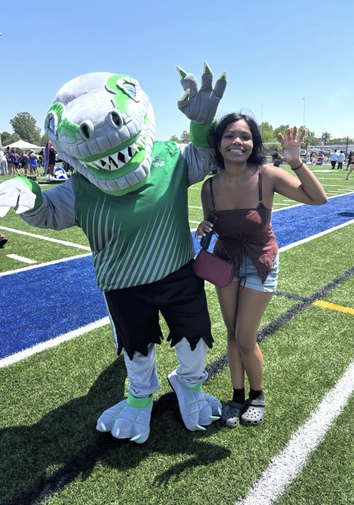 research lab Raptors mascot with student