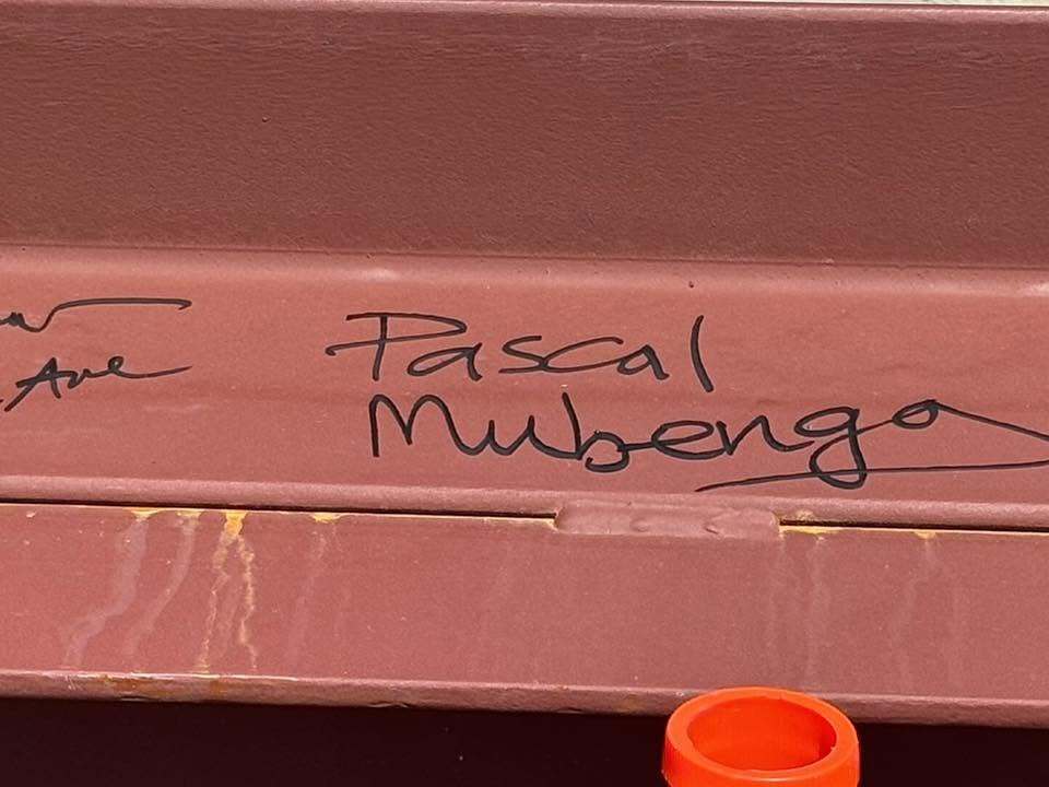 steel beam with Dr. Mubeng's Name on it