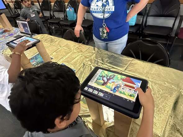Students making videos on ipads
