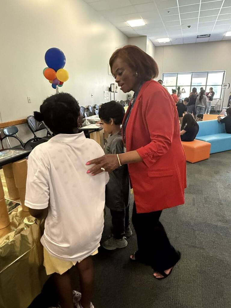 Adult Teacher Talking to students 