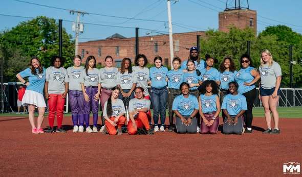 Softball players standing for photo