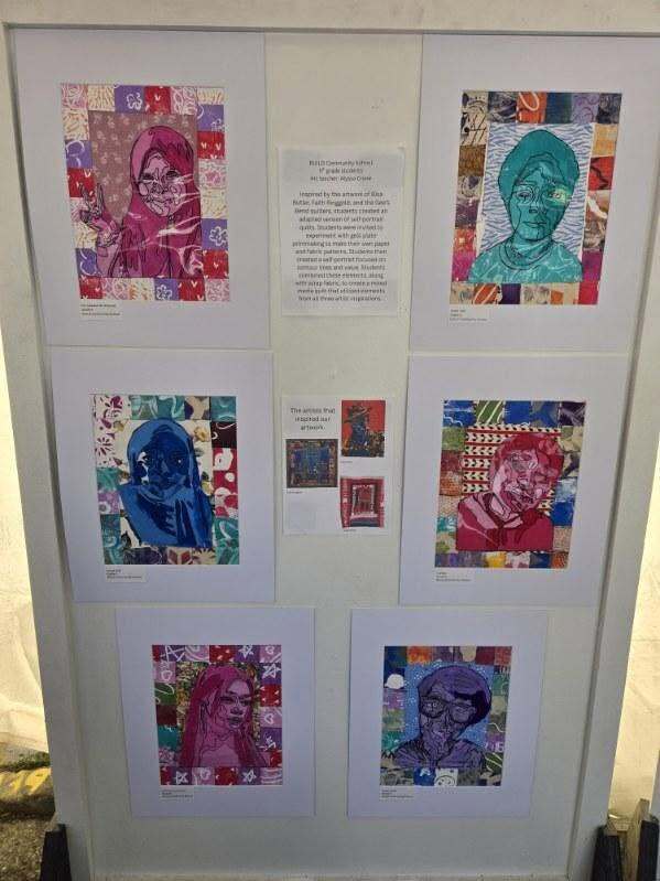 Display board featuring multiple student portrait artworks arranged in a grid, each created with colorful patterned backgrounds and mixed media styles, with a description panel in the center.