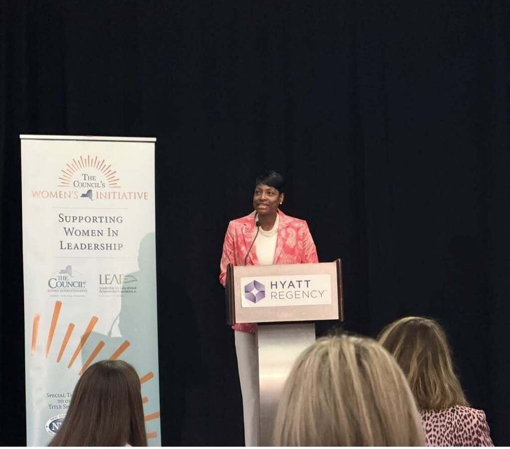 School Leader speaking at podium 