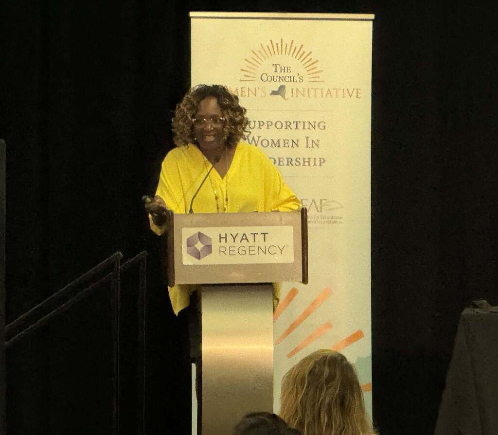School Leader speaking at podium 