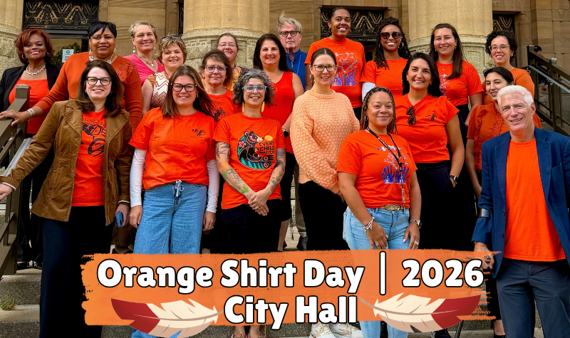 Members of City Hall Staff in a group in Orange shirts