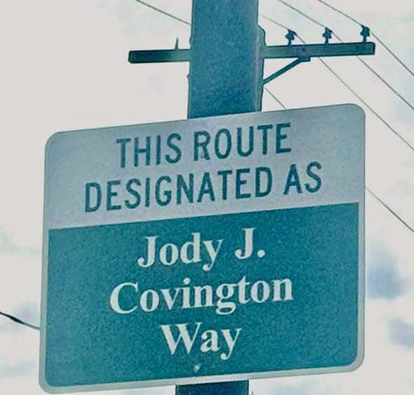 Road sign that reads Jody Covnington Way