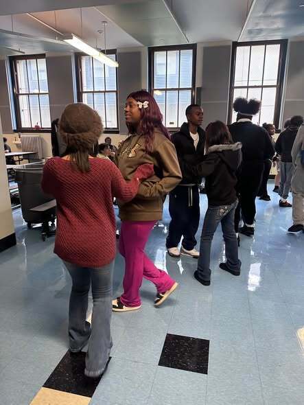 Students and Adults Salsa Dancing