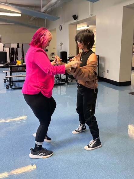 Students and Adults Salsa Dancing