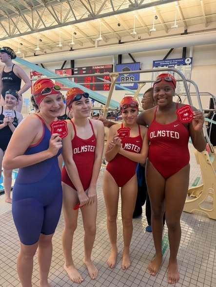 BPS Girls Swimmers holding Varsity Sectional Award