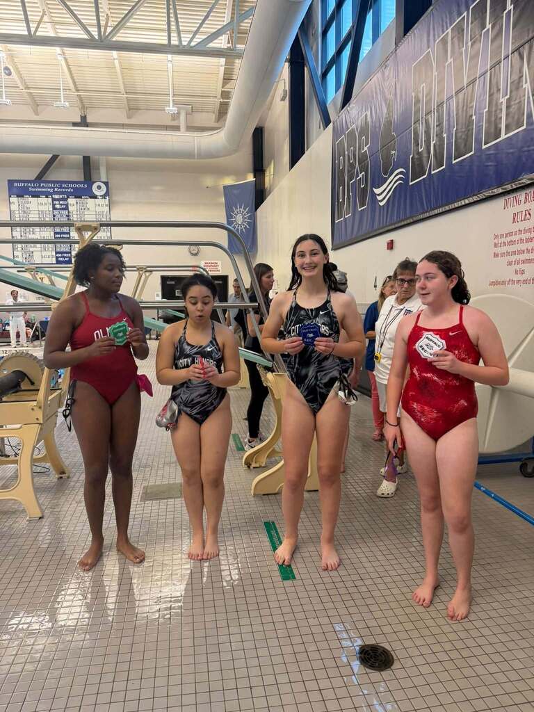 BPS Girls Swimmers holding Varsity Sectional Award