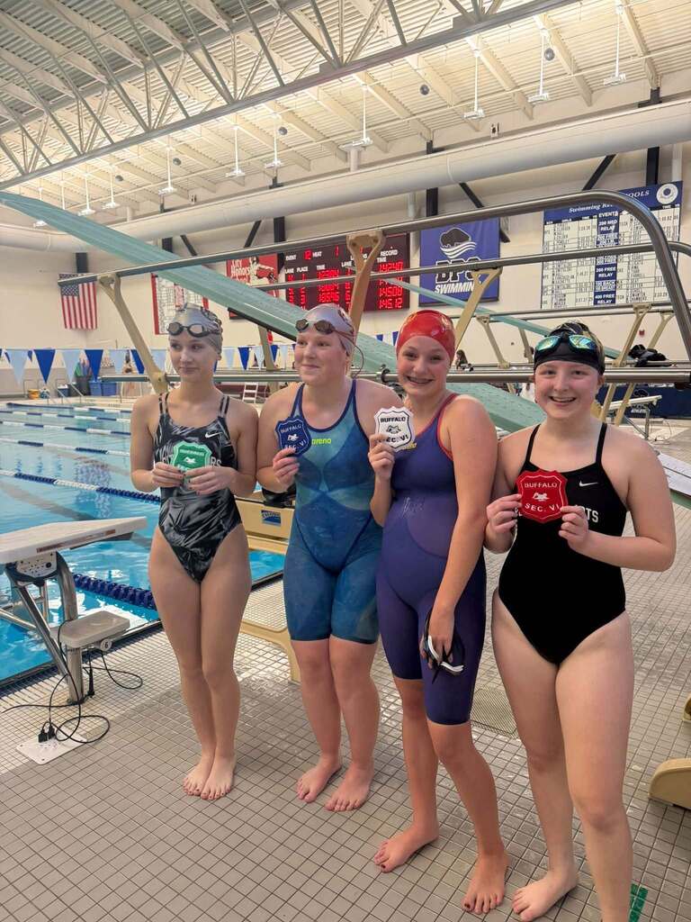BPS Girls Swimmers holding Varsity Sectional Award
