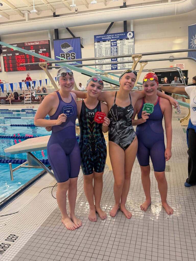 BPS Girls Swimmers holding Varsity Sectional Award