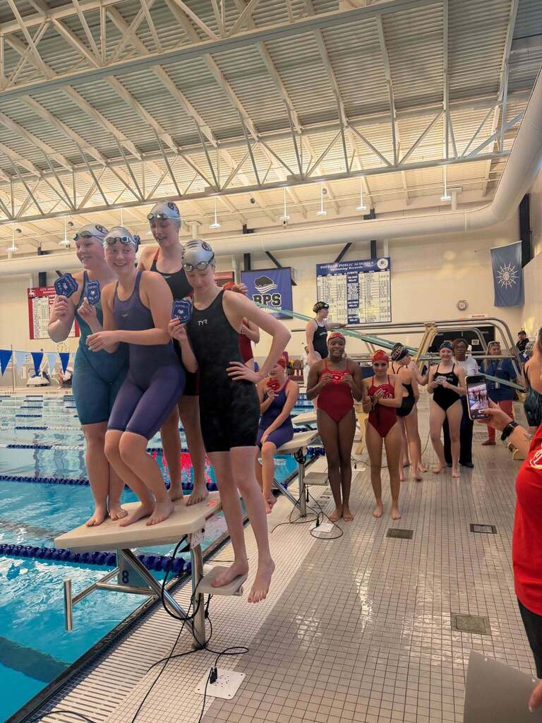 BPS Girls Swimmers holding Varsity Sectional Award