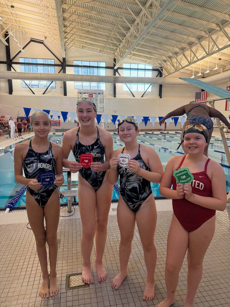 BPS Girls Swimmers holding Varsity Sectional Award