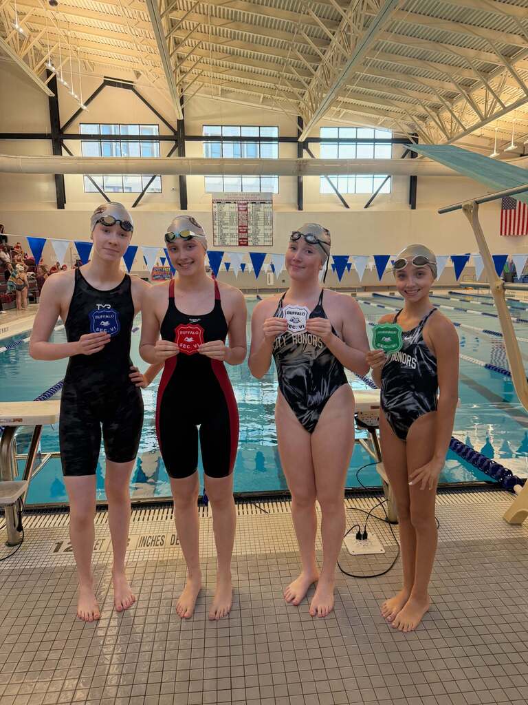 BPS Girls Swimmers holding Varsity Sectional Award