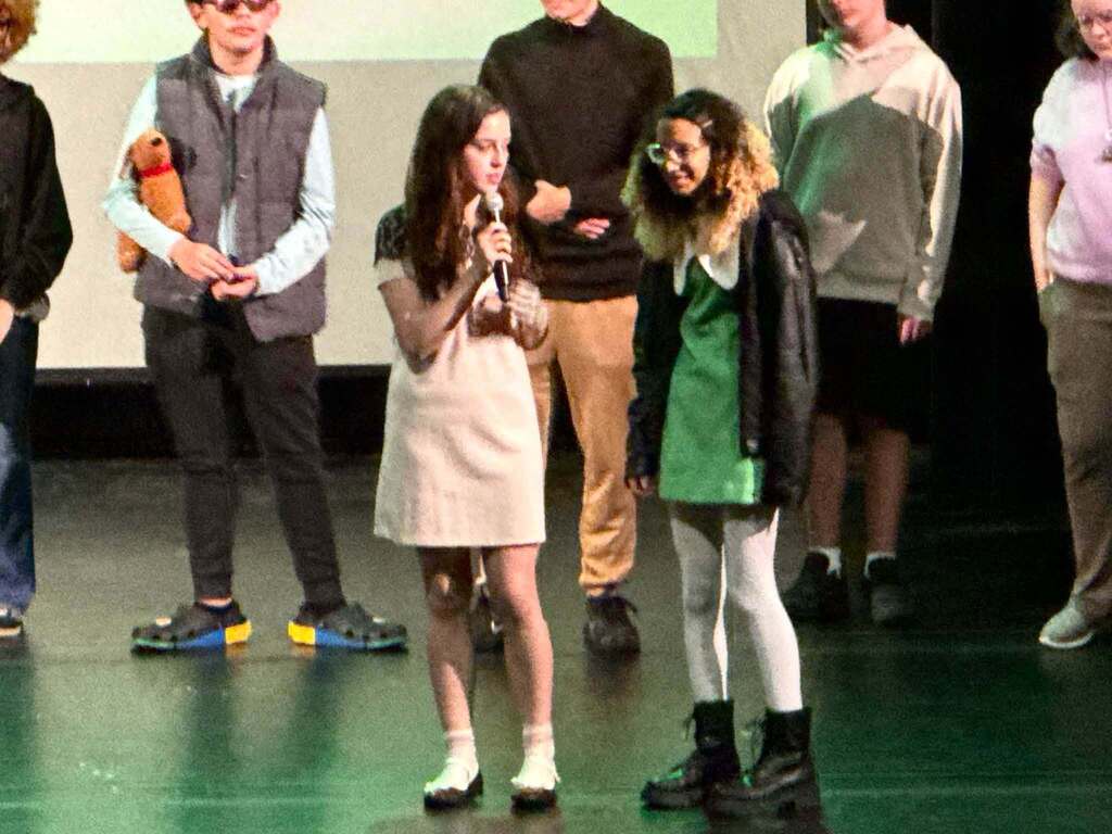 Students taking questions after movie