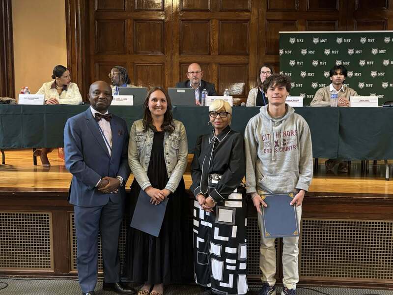 Superintendent Mubenga with Student Athletes, and Board Members