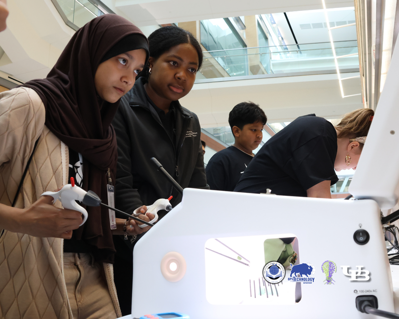 Girls flying virtual Drones on computer