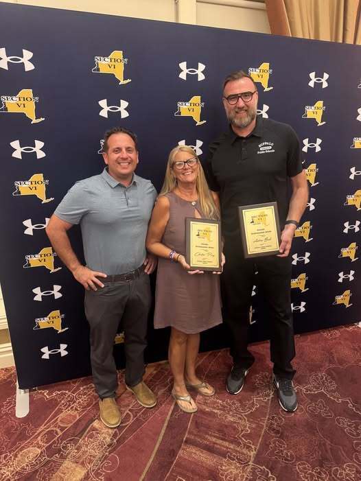 Picture of Coaches holding awards