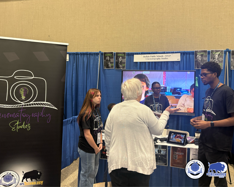 BPS Students at Conference at their booth talking to people